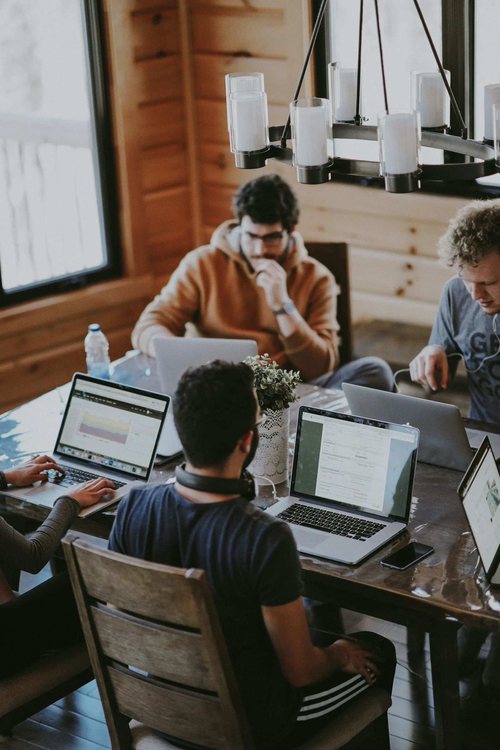 Stock photograph of colleagues sharing ideas at a table